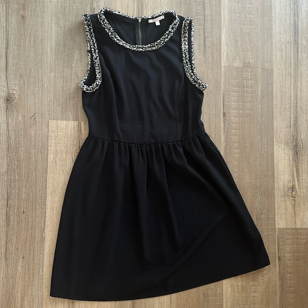 Black cocktail dress with fringe detailing
